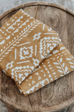 TAPESTRY SWADDLE - HONEY GOLD